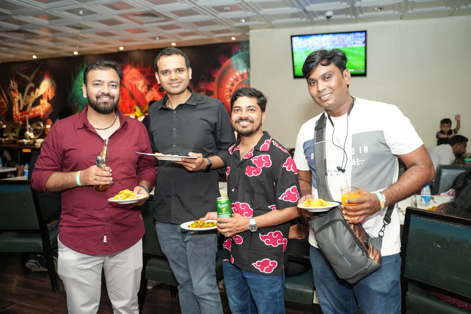 Corporate team celebrating together on the Deltin Royale casino cruise, produced by SOS Party.