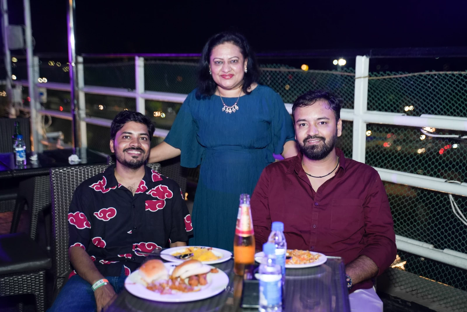 Corporate guests enjoying rooftop views from the Sky Bar on Deltin Royale during a Goa offsite.
