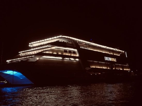 Exterior view of Deltin Royale, Asia's largest offshore casino, lit up on the Mandovi River for a corporate evening in Goa.
